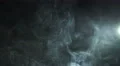 The stream of thick smoke on the background of dark surface. Slow motion capture 4k or 4k+ Resolution