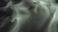 The stream of thick smoke on the background of dark surface. Slow motion capture 4k or 4k+ Resolution