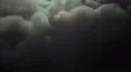 The stream of thick smoke on the background of dark surface. Slow motion capture 4k or 4k+ Resolution