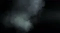 The stream of thick smoke on a dark background. Slow motion capture 4k or 4k+ Resolution