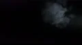 The stream of thick smoke on a dark background. Slow motion capture 4k or 4k+ Resolution