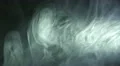 The stream of thick smoke on a dark background. Slow motion capture 4k or 4k+ Resolution