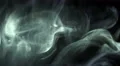 The stream of thick smoke on a dark background. Slow motion capture 4k or 4k+ Resolution