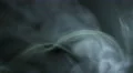The stream of thick smoke on a dark background. Slow motion capture 4k or 4k+ Resolution