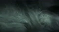 The stream of thick smoke on a dark background. Slow motion capture 4k or 4k+ Resolution