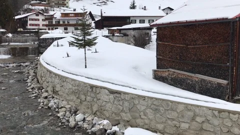 Stream through Austrian village Stock Footage 104819088