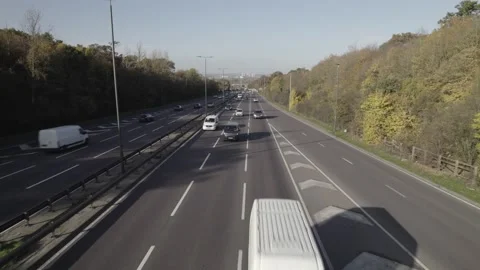 Stream of vehicles driving on multilane highway on sunny day Video stock 167956578