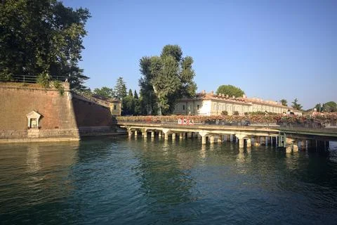 Stream of water bordered by an old fortification Stock Photos
