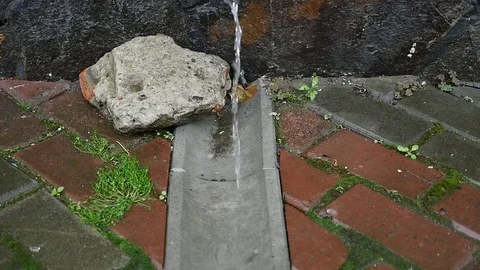 A stream of water drains into a drain Stock Footage