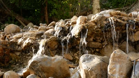 Stream water dripping through rocks Stock Footage 279442642