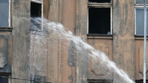 Stream of water from a fireman's hose 스톡 동영상 99352014