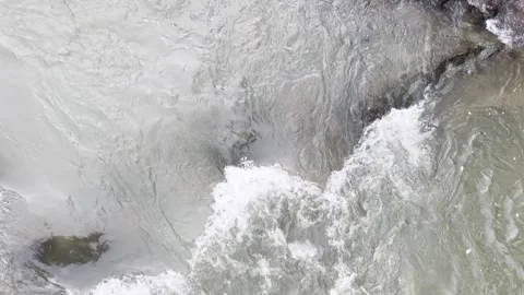 A stream of water is flowing between rocks Stock Footage 296182967