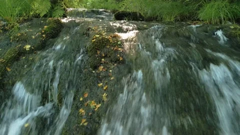 Stream Of Water Flowing Down On Rocks. closeup shot Stock Footage 283655873