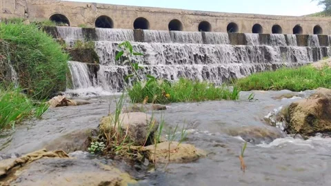 Stream water flowing over rocks Stock Footage 275341068