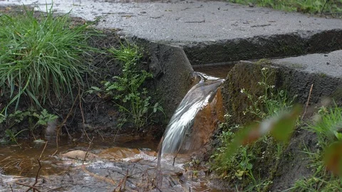 Stream of Water Flowing from a Platform Stock Footage 88999734