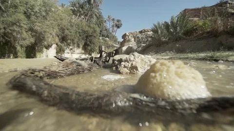 Stream of water flowing in slow motion Stock Footage 79736880
