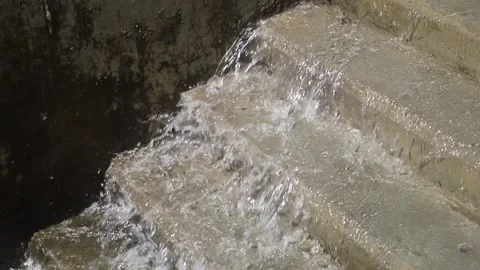 A stream of water flows down the stairs Stock Footage 160215960