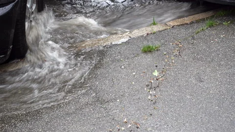 The stream of water flows over the wheels of the car Video stock 137115441