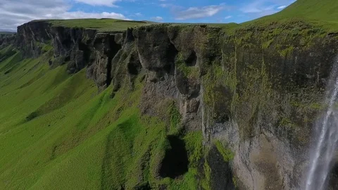 A stream of water flows from a rock cliff. Andreev. Video stock 78534186