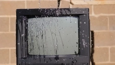 A stream of water flows to the TV. Surprises and accidents concept Stock Footage 81677957