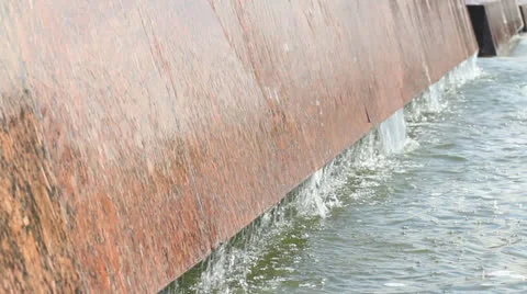 The stream of water on the granite border Stock Footage 25426600