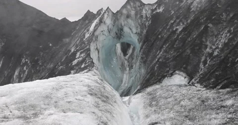 Stream water melt from ice flowing through cave in Solheimajokull glacier cov Stock Footage 213601015