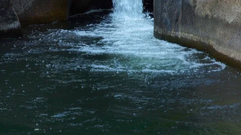 Stream water in mountain river pouring on large stones. Water stream from Stock Footage 90651189