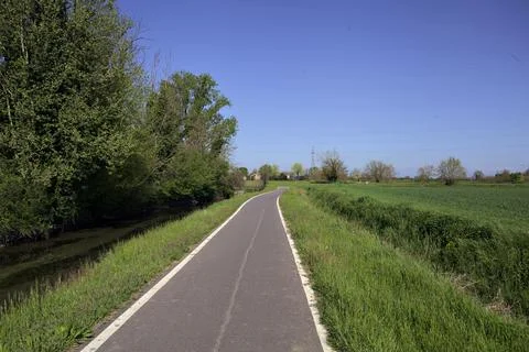 Stream of water next to a field Stock Photos
