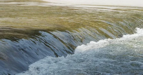 Stream of water in a river Stock Footage 136029777