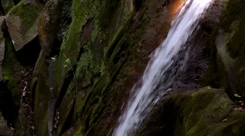 Stream of water running over rocks Stock Footage 7752925