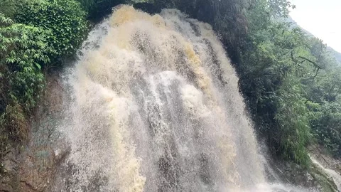 Stream of water rushing down a waterfall in slow motion Stock Footage 275187175