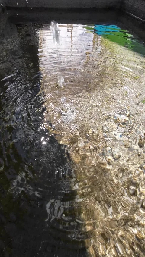 Stream of water from a spring fountain falling into a pond, background for .. Stock-Footage 294602760
