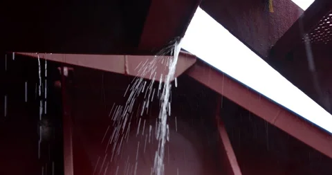 Stream of water swiftly flows down steel framework Vídeos de archivo 321774157