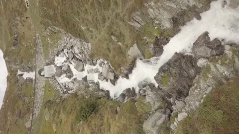 A stream-waterfall running through the mountain.(Vertical video). Stock Footage 149107614