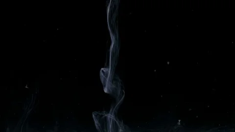 Stream of white paint poured in dark water seems a soft smoke rapidly flowing Stock Footage 79780051
