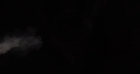 Stream of white smoke on an isolated black studio background Stock Footage 99690397