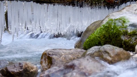 Stream in winter with icicles, Julian Alps in Slovenia, Europe Video stock 89836008