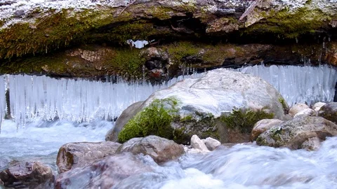 Stream in winter with icicles, Julian Alps in Slovenia, Europe Video stock 89836046