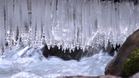 Stream in winter with icicles, Julian Alps in Slovenia, Europe Видео 89836064