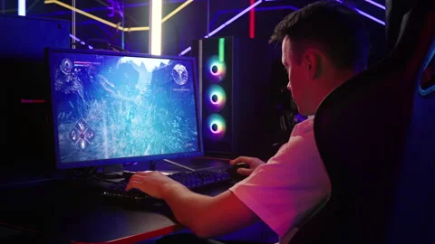 Streamer broadcasting the single player battle mission of the modern pc game Stock Footage 249383021