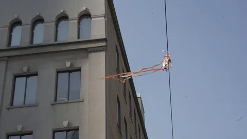 Streamer Object blowing In Breeze on Ribbon Building Blue Sky Stock Footage 85852784