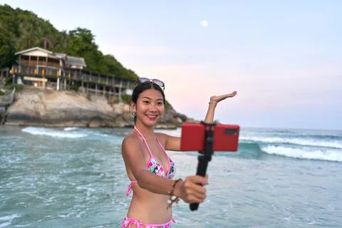 Streamer showing the moon while performing live during the Full moon party Stock Photos