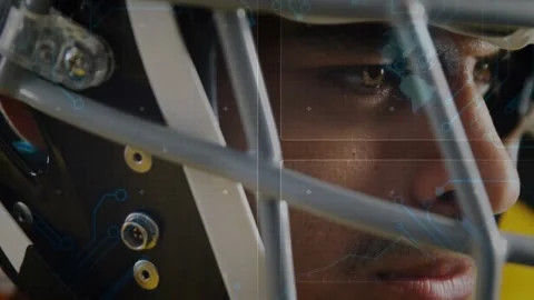 Streaming code overlays flickering around helmet initiating sport tech analysis Stock Footage 317740237