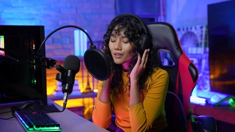 Streaming concept of 4k Resolution. Asian woman recording singing in studio.  Video stock 171241871