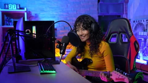 Streaming concept of 4k Resolution. Asian woman playing guitar and recording  Stock Footage 196982642