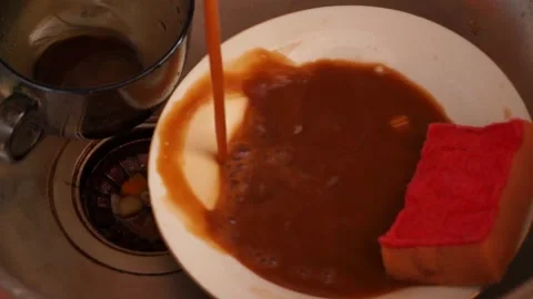 Streaming dirty rusty brown water in sink. Water stream going down the drain Stock Footage 157096994