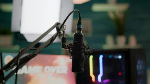 Streaming professsional microphone in empty gaming home studio Stock Photos