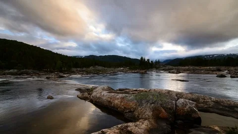 Streaming river with rocks in the foreground and moving clouds, Setesdal, Norway Video stock 81254791