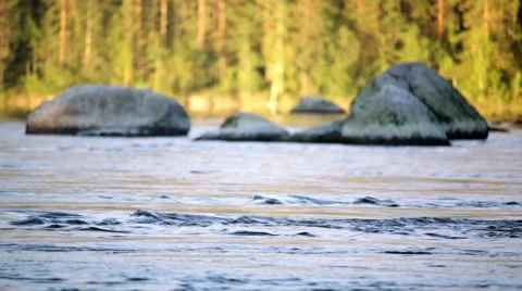 Streaming river with soft focus stones in the background Stock Footage 68724425