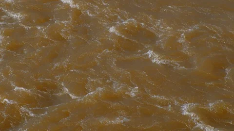 Streaming strong current on river at spring flood, high water. Video stock 129602977
